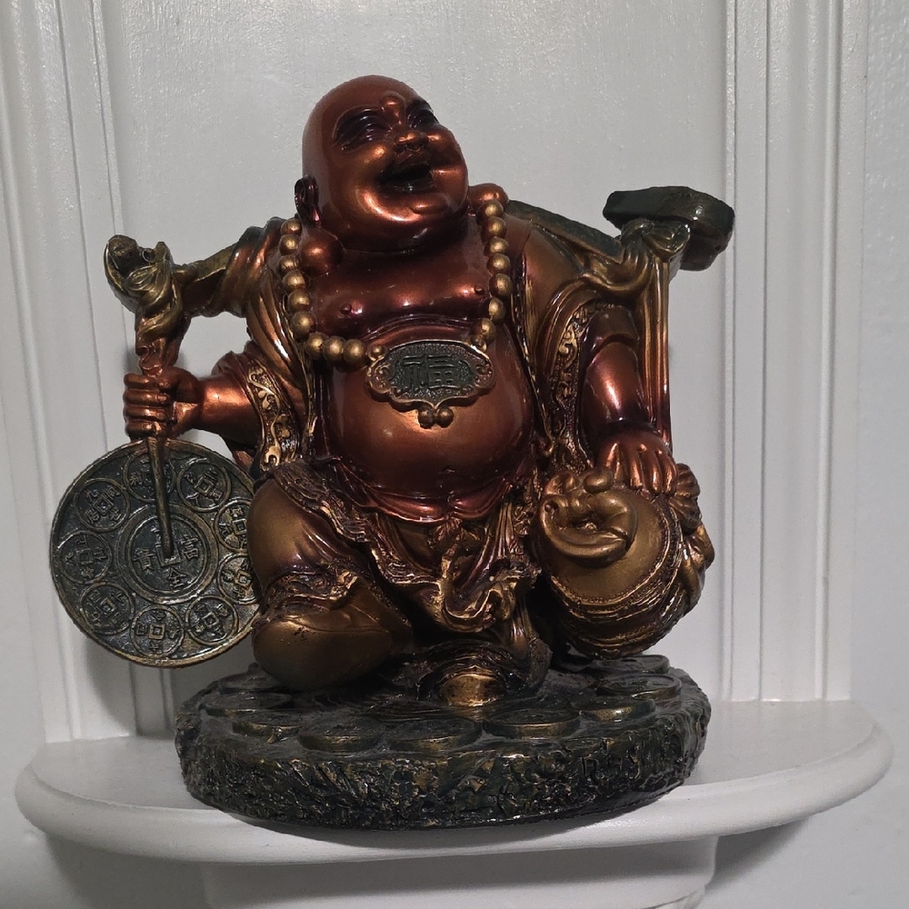 This figurine is a Feng Shui Laughing Buddha statue, Good Luck